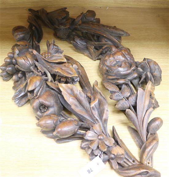 A pair of walnut fruit carvings